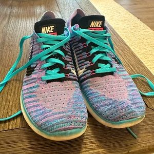Size 8.5 Nike Free RN FlyKnit Motion Women’s running shoes.